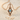 Blue Stone Kite Pendant, rose gold, product photo on sand