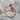 Ouroboros Band Ring, rose gold, angled view on stone