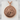 Three Headed Dragon Medallion Pendant, rose gold plated silver, front view on stone pedestal