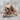 Skull Zihgir Ring, rose gold plated, side view on stone surface