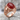 Carnelian Skull Ring, rose gold, product photo on stone surface