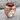 Past Master Carnelian Ring, rose gold, angled view on stone base