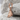 Brutalist Shard Earring in rose gold, angled view on rock