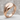 Cracked Oval Signet Ring, rose gold, angled product photo on stone