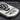 Memento Mori Dog Tag Pendant, oxidized silver, close-up of skull and hourglass relief