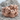 Men Embracing Ring, rose gold, front view on stone surface