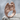 Weeping Angel Ring, rose gold, front view on stone surface
