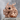 Japanese Ryu Dragon Ring, rose gold, front view on stone pedestal