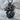 Roaring Japanese Dragon Pendant, black rhodium plated, angled front view on stone