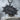 Manga Dokan Impact Pendant, black rhodium, front view on stone pedestal