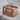 Built Not Born Dumbbell Ring, rose gold, product photo on stone surface