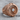 Jet Engine Turbine Ring, rose gold plated, product photo on wood surface