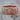 Royal skull ring, rose gold finish, front product view on wood