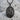 Saint Joseph Medallion Pendant, black rhodium, front view product photo on stone