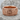 Gothic Scroll Cross Ring, rose plated silver, angled front view on stone