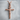 INRI Crucifix Pendant, rose gold, front view on stone pedestal