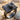 Rangefinder camera ring, black rhodium, product photo on sand