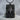 Surrealist Sci-Fi Pendant, black rhodium, front view resting on stone