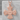 Celtic knot cross pendant, rose gold, product view on stone block