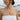 Model wearing delicate mother dragon necklace chain outdoors featuring detailed curved dragon pendant design