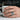 Handcrafted wide band sunflower daisy ring in oxidized silver displayed on hand holding a white coffee mug