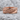 Volcanic Lava Ring, rose gold finish, front view on rock