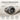 Detailed view of oxidized sterling silver jet turbine ring resting on beige linen showing comfort edges craftsmanship