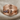Hidden Face Wave Ring, rose gold, product photo on fabric