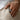 Handcrafted oxidized silver Bitcoin signet ring worn on index finger in casual men's fashion photo
