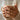 Celtic Braided Knot Ring worn on model holding a mug
