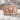 SOA Skull Signet Ring, rose gold, angled product photo on stone