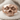 Zombie Skull Ring, rose gold, front product view on fabric