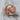 Trepanation Signet Ring, rose gold plated silver, product photo on wood surface