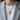 Stylized guardian angel pendant necklace worn over white shirt and grey blazer for elegant daily wear