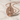 Saint Barbara Pendant, rose gold, angled view on marble surface