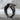 Swooping Eagle Ring, black rhodium, angled product view on concrete
