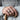 Cobblestone Rock Ring, oxidized silver, worn on model hand holding cane