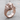 Elephant Head Ring, rose gold, angled view on wood