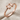 Fascinus Stacking Ring, rose gold, angled view on fabric