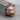 Snarling Tiger Head Pendant, rose gold, angled view on wood block