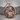 Flowing Hair Virgo Zodiac Pendant, rose gold, product photo on wood