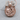Sun and Moon Faces Pendant, rose gold, product photo showing warm metallic finish