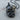 Coiled Serpent Apple Pendant, black rhodium, product photo on wood base