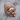 Mustache Skull Ring, rose gold, three-quarter view on wood