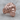 Hercules Lion Ring, rose gold, angled front view on wood