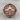 Compass Skull Ring, rose plated silver, front view on wood