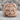 Medieval Cross Ring, rose gold, front view resting on stone