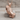 Draped Praying Hands Pendant, rose gold, product photo on wood block
