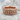 Skull Eternity Ring, rose gold, resting on stone