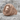 Greek Key Lion Ring, rose gold, angled view on stone